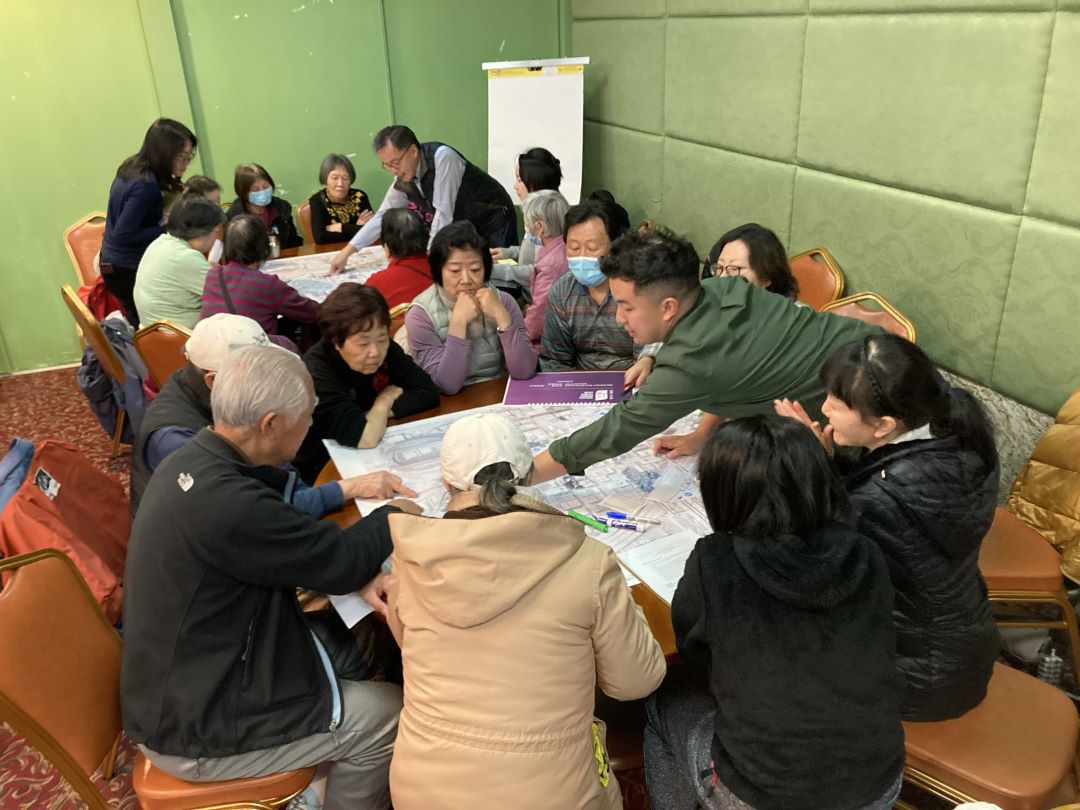 Photo of facilitators guiding workshop participants through an interactive exercise.